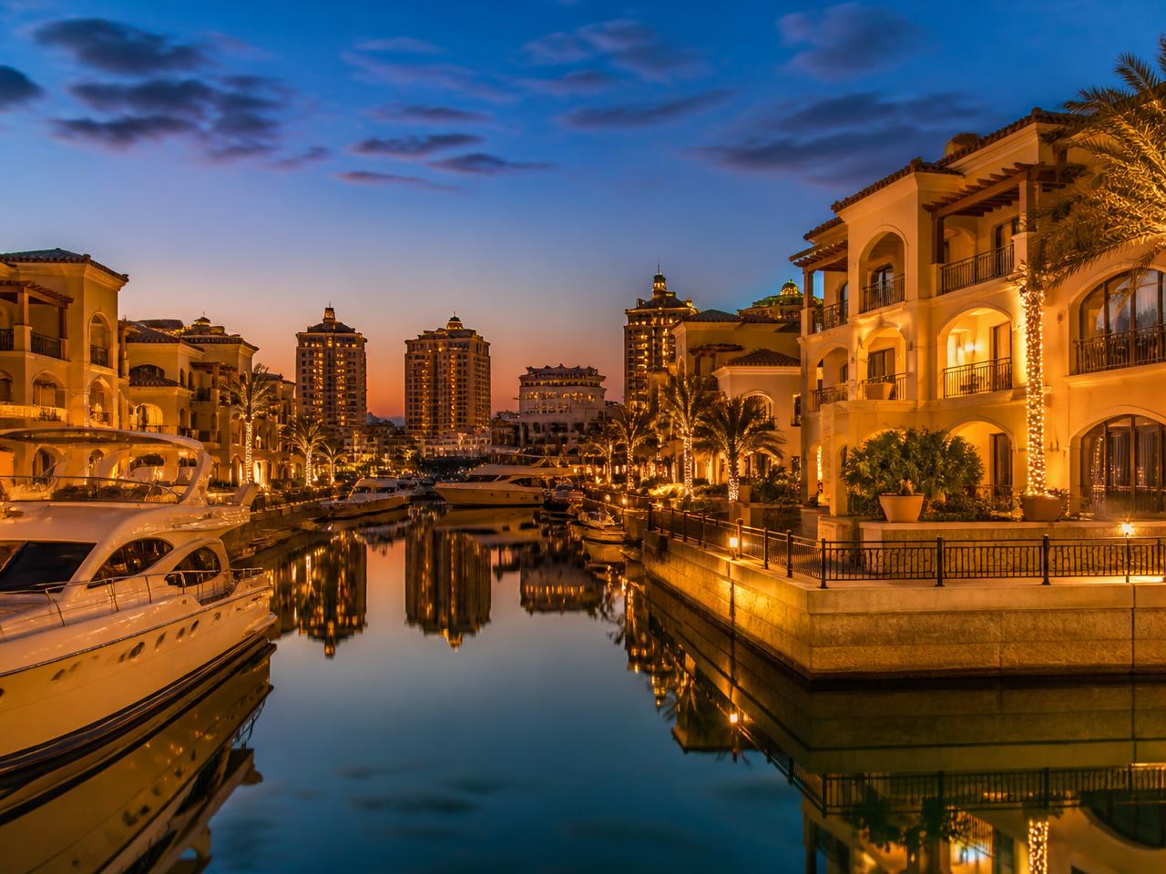 Porto Arabia marina villas at The Pearl-Qatar illuminated at dusk